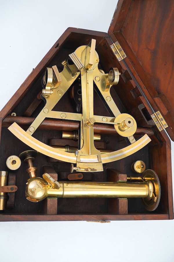 A 19th century Troughton & Simms, London, cased brass sextant, stamped number 2207, engraved for Lieut. Clark R.A., cased with stand and other accessories, case 36.5cm x 34.5cm. Condition - good